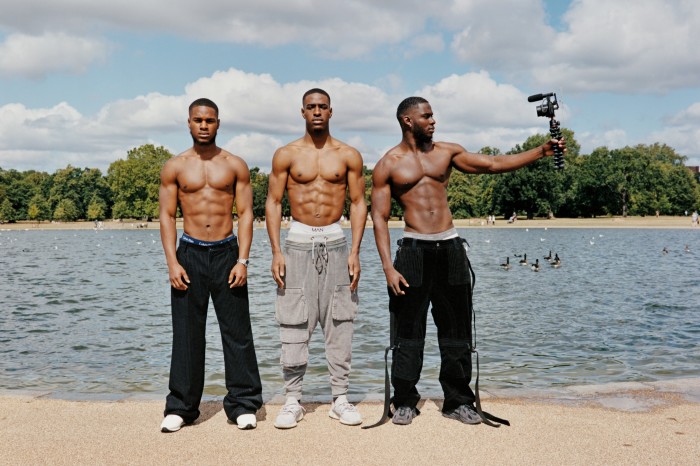 Dennis Fagbemigun, left, personal trainer, wears Dolce & Gabbana velour-mix trousers, £1,400. Trunks, model’s own. Mallet Diver low-top trainers, £165. Watch, model’s own. Nosa Okonedo, middle, model and YouTuber, wears Dolce & Gabbana cotton/silk-mix trousers, £875. Trunks, model’s own. Adidas Originals Ozweego trainers, £90. Moses Ldn, right, personal trainer, wears Dolce & Gabbana velour-mix trousers, £1,400. Trunks, model’s own. Adidas Originals Ozweego trainers, £90