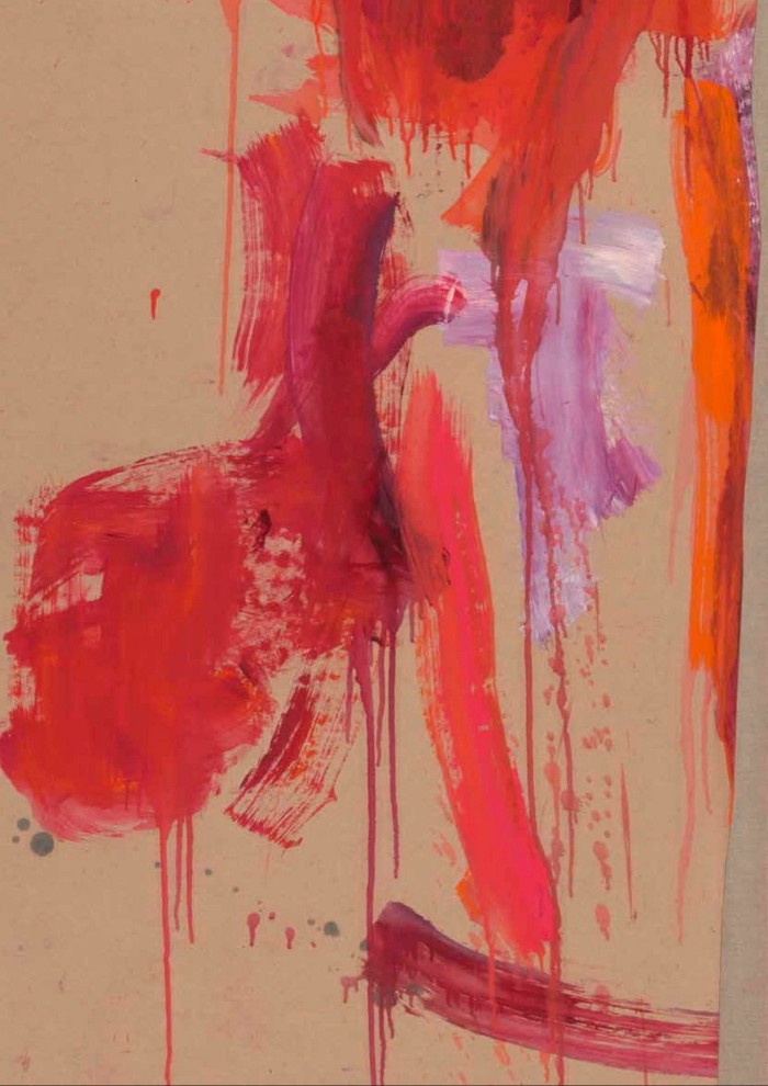A light brown canvas with splashes of red and pink paint