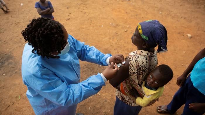 A health worker administers a Covid vaccine in Zimbabwe. Developing countries have lower vaccination rates than western nations