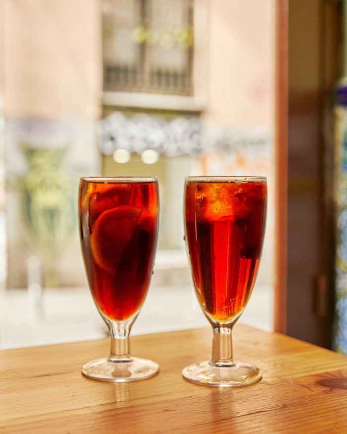 Two glasses of vermouth on a table in Casa Camacho