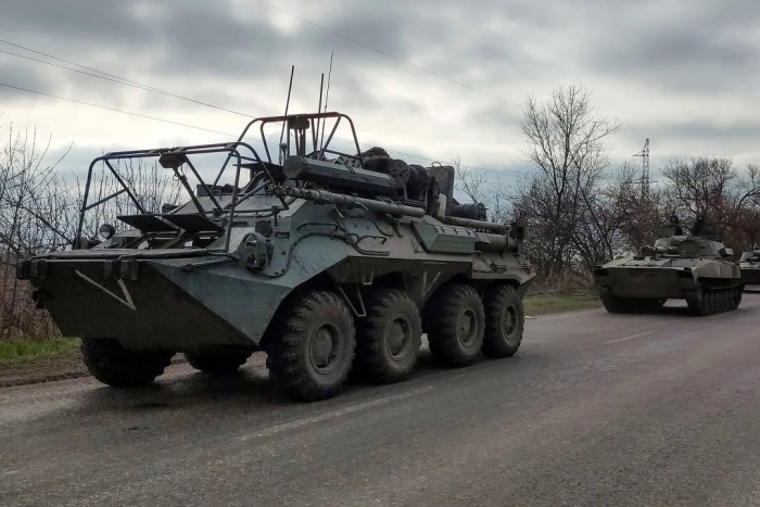 Russian armoured vehicles advance near the Ukrainian city of Mariupol in April 2022