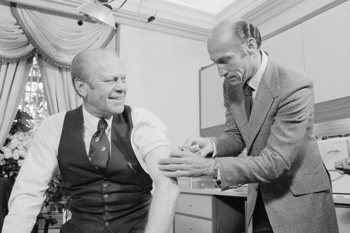Former US president Gerald Ford receives a swine flu shot in 1976