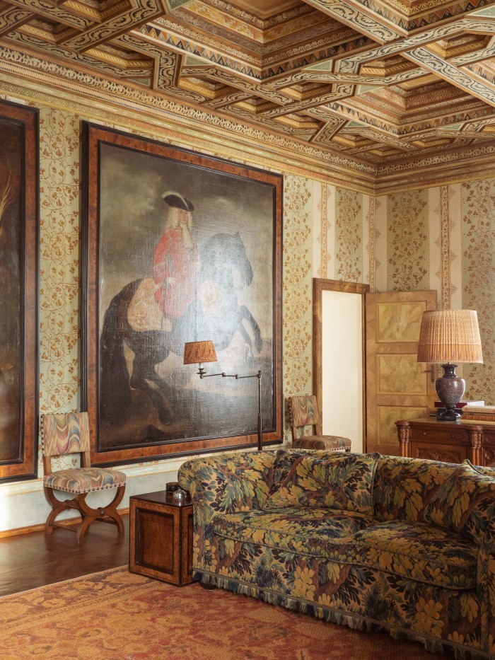 The Green living room at Castello di Cigognola with its ceiling of 12 individual design motifs in oak panel squares