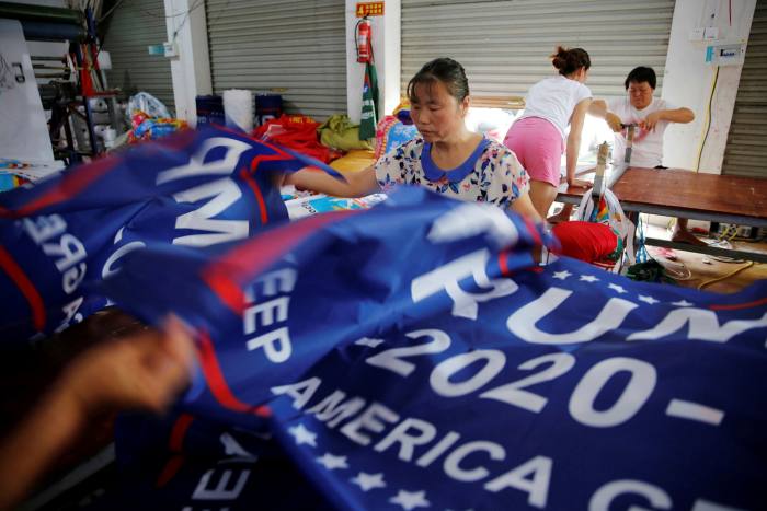 Workers make flags for Trump’s ‘Keep America Great!’ 2020 re-election campaign at a factory in Fuyang, Anhui province, China