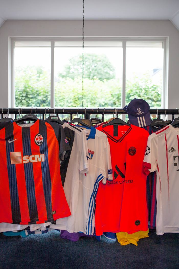 Some of his collection of football shirts