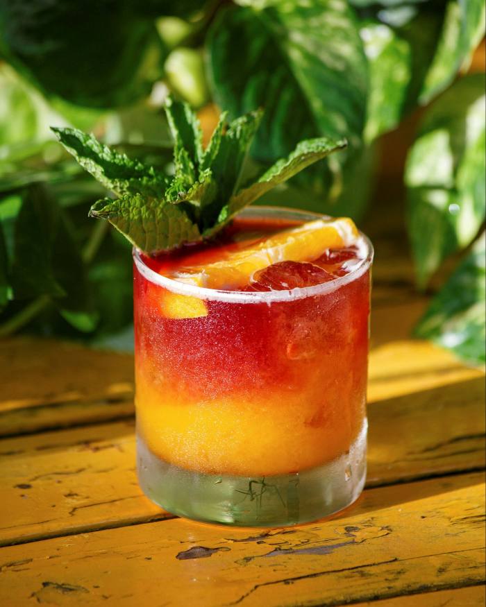 . . . where you might kick back with a Thought Adjuster: rye, mango and orange topped with red wine