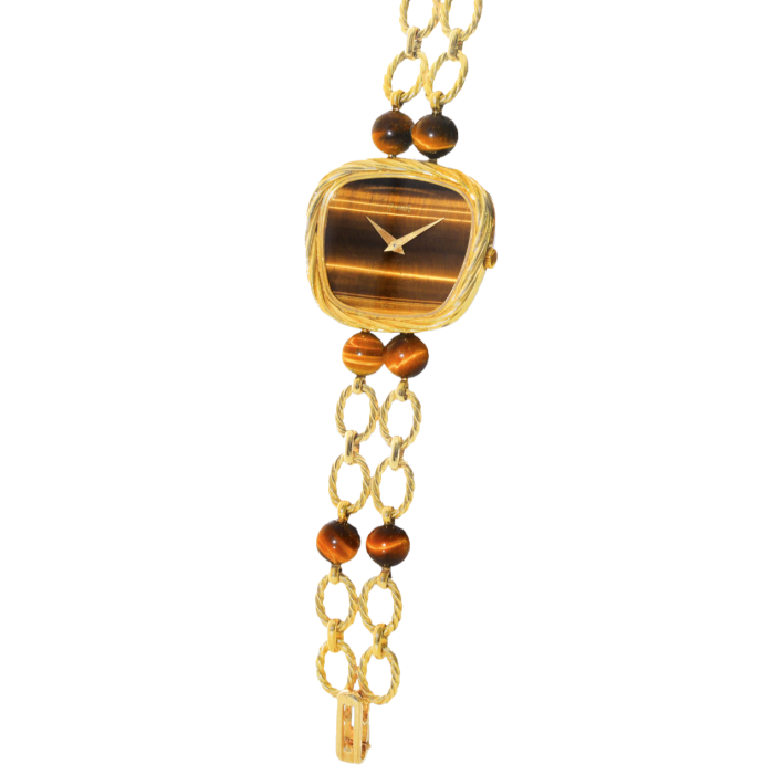 The 1970s textured-gold and tiger’s-eye watch offered by Meeting Art