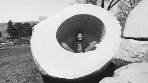 The inspiration: Isamu Noguchi inside his sculpture Momo Taro in 1985