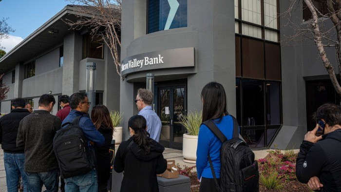 Customers in line outside Silicon Valley Bank headquarters in Santa Clara, California