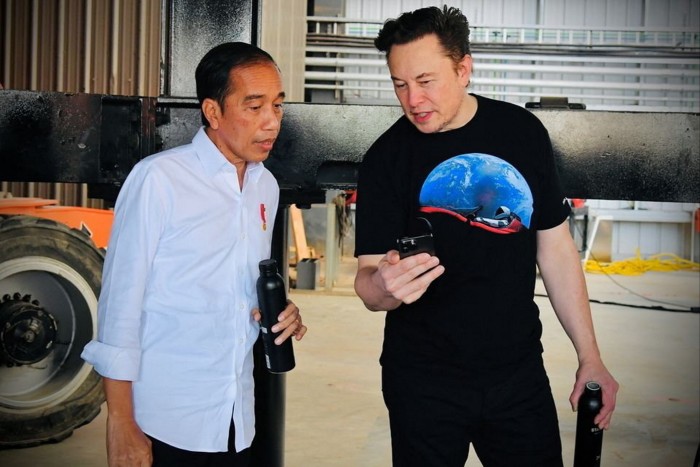 Indonesian President Joko Widodo talks with CEO of Tesla Elon Musk at the SpaceX launch site in Boca Chica, Texas, in May 2022