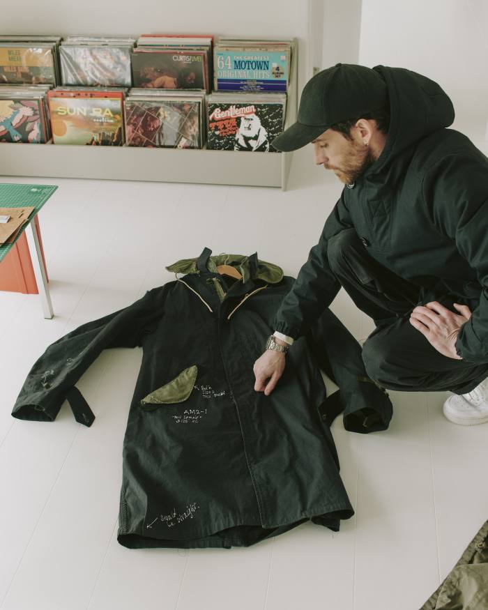 Berryman with the prototype for the Applied Art Forms AM2-1 modular parka. He wears its CM1-1 hooded deck jacket, €790