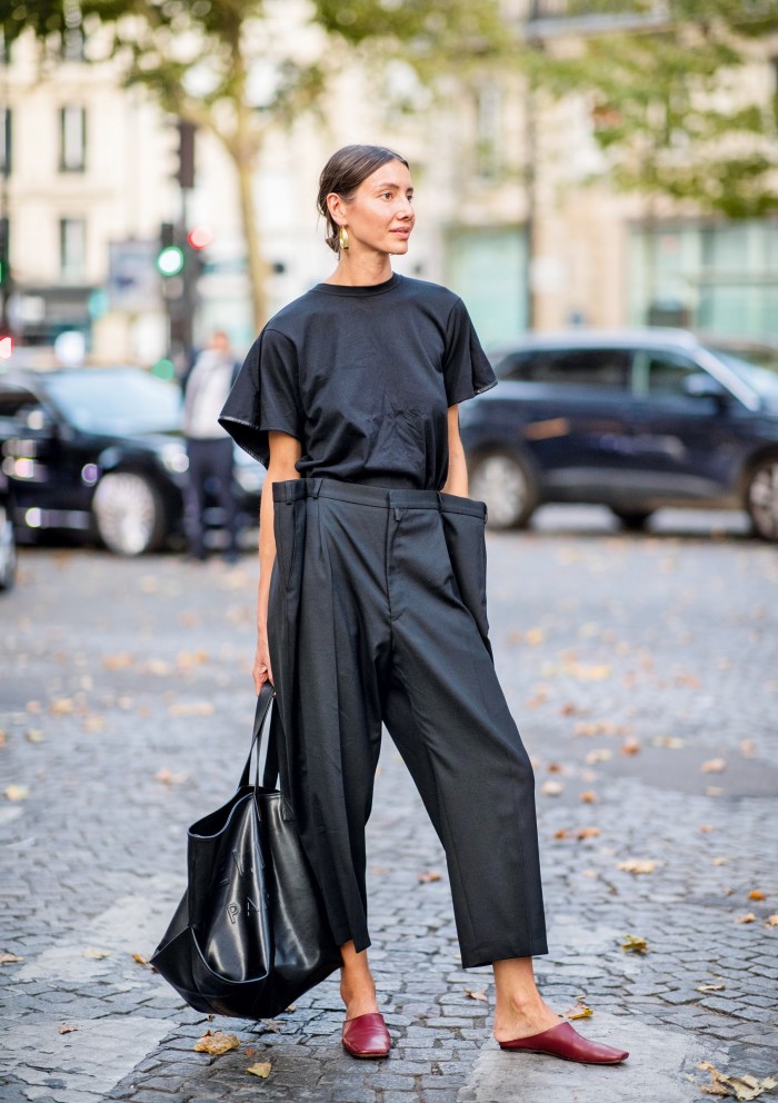 Vogue Ukraine fashion director Julie Pelipas in oversized trousers at Paris Fashion Week 2018