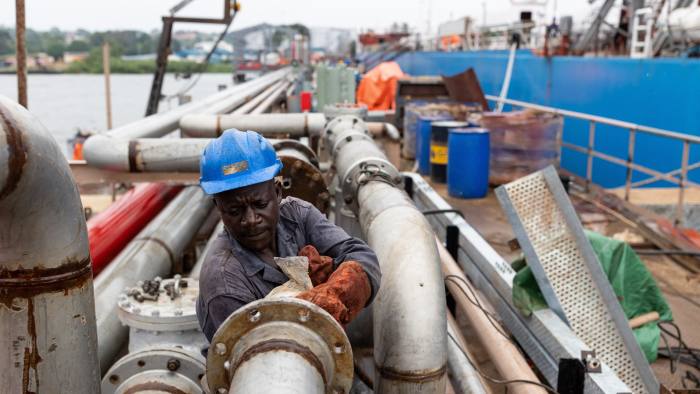 A Ugandan worker works on a pier stretching 256 meters into Lake Victoria at a new fuel storage complex