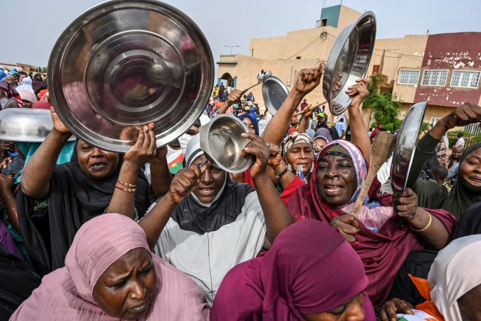 Supporters of Niger’s National Council of Safeguard of the Homeland (CNSP) protest outside the Niger and French airbase in Niamey on August 30, 2023