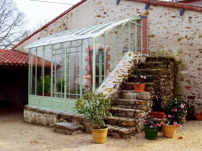 A glasshouse by Serres et Ferronneries d’Antan