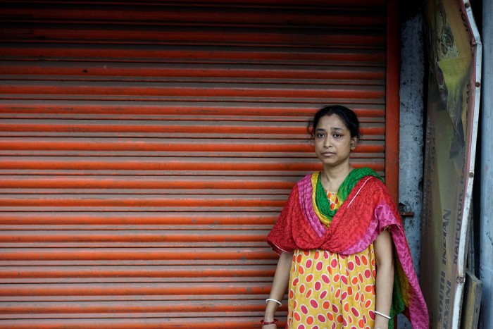 Shompa Karmakar in front of her shuttered restaurant in Kolkata, India