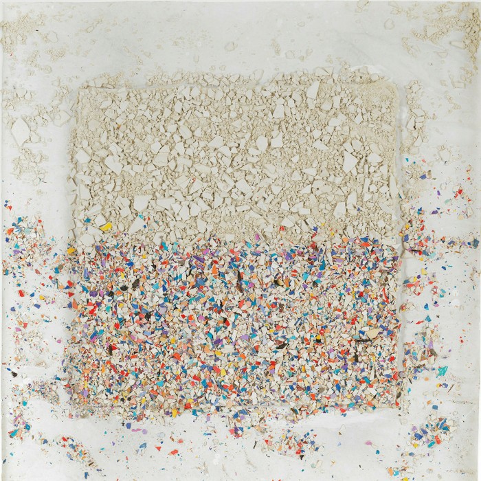 A square made up of tiny ceramic fragments, white on the top half, coloured on the bottom