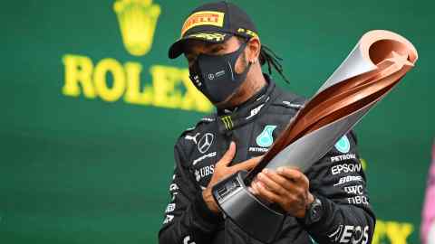 Lewis Hamilton celebrates on the podium after winning the Turkish Formula One Grand Prix in 2020