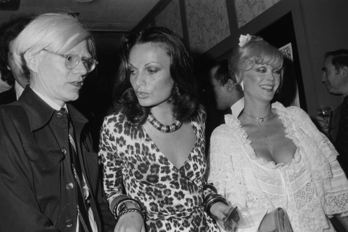 Diane von Furstenberg with Andy Warhol and actress Monique van Vooren in New York, 1974