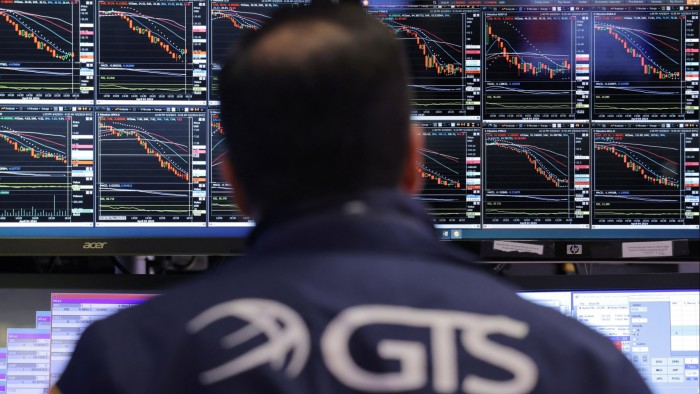A trader works on the trading floor at the New York Stock Exchange