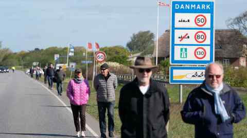People gather at the border crossing at Saed, Denmark, on Sunday for a demonstration to open the frontier between Denmark and Germany