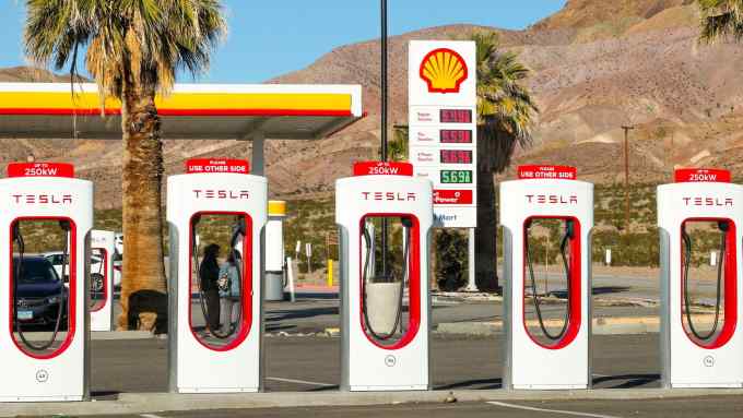 Tesla chargers in front of a Shell petrol station in Cailfornia