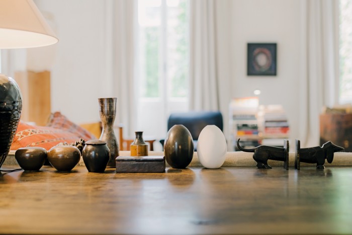 three urns with the ashes of his dogs, two vases by Guido Gambone, a leather box brought back from a trip to Morocco, egg-shaped vases by Ted Muehling and cast-iron bookends from the ’20s brought back from a trip to New York