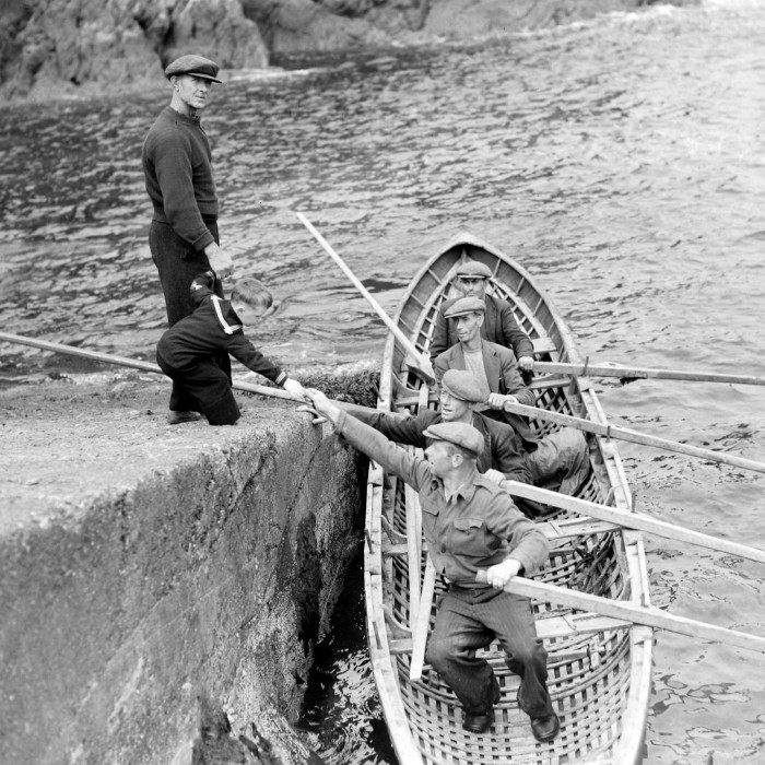 Gearóid Cheaist Ó Catháin, the last child to be brought up on Great Blasket, greets a boat in 1951