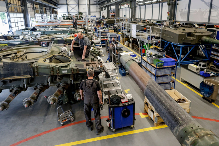 Rheinmetall technicians assemble a Leopard battle tank
