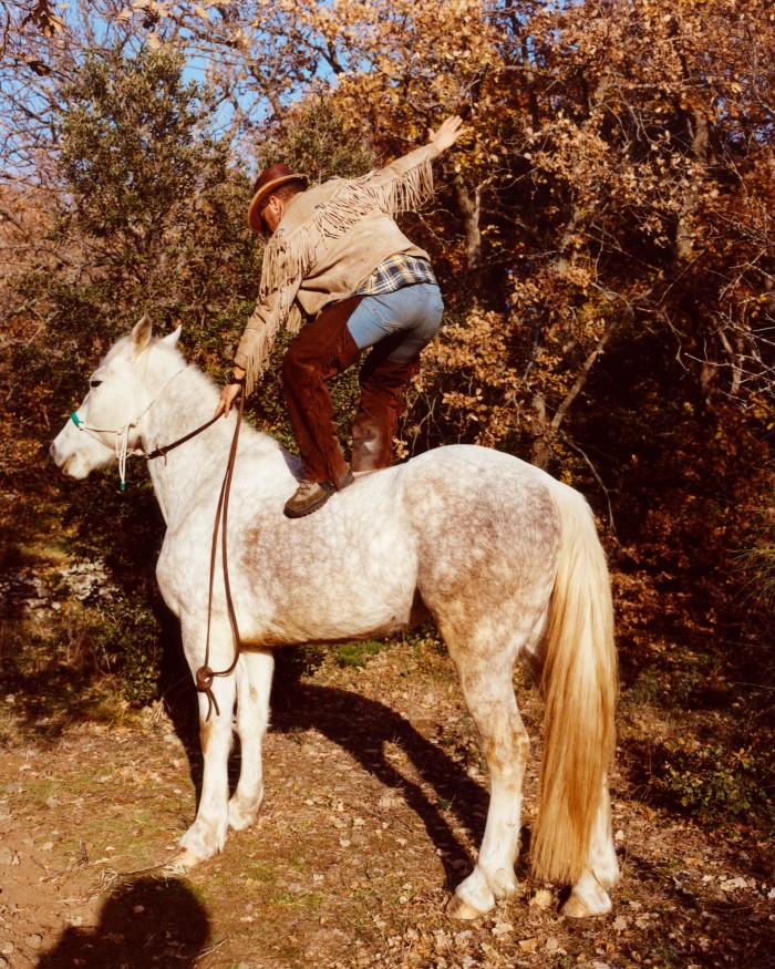 Emanuele, a horseriding instructor and equestrian performer with a passion for Native American culture, on his horse Lola