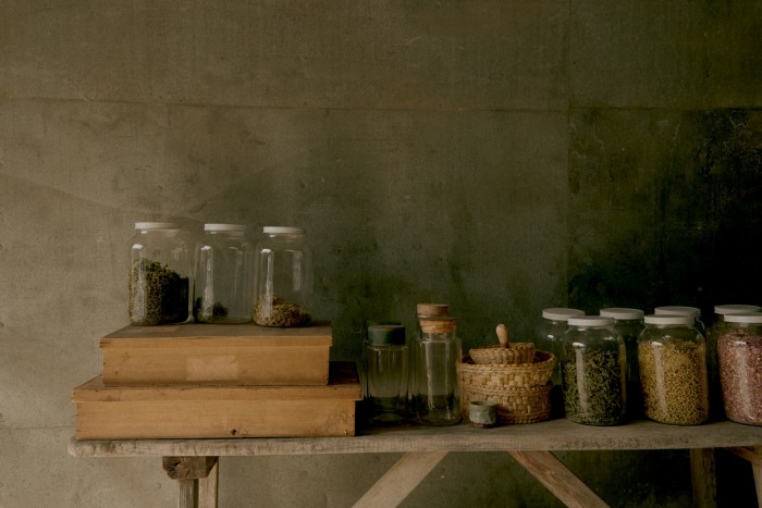 Herbs stored in jars in the author’s drying room (“aka my garage!”)