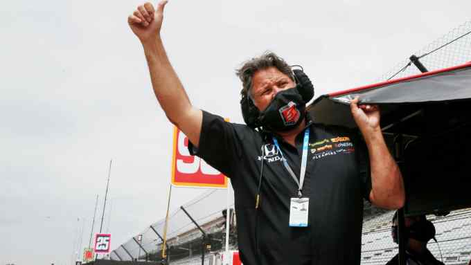 Car owner Michael Andretti gives a thumbs-up sign as he watches in the pits during practice for the 105th running of the Indianapolis 500