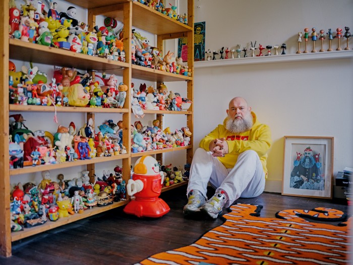 With his collection of vintage dolls