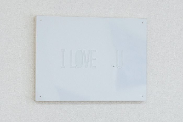 A pale plaque bears the words “I Love U”