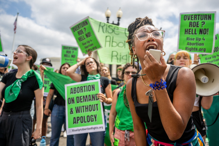 Abortion rights demonstrator Elizabeth White leads a chant in response to the Dobbs v Jackson Women’s Health Organization ruling in front of the U.S. Supreme Court