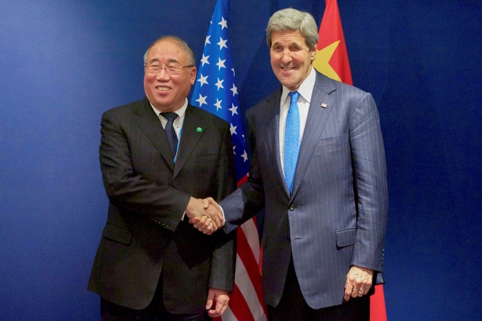 Xie Zhenhua and John Kerry meet in 2015 on the margins of the Paris climate change summit
