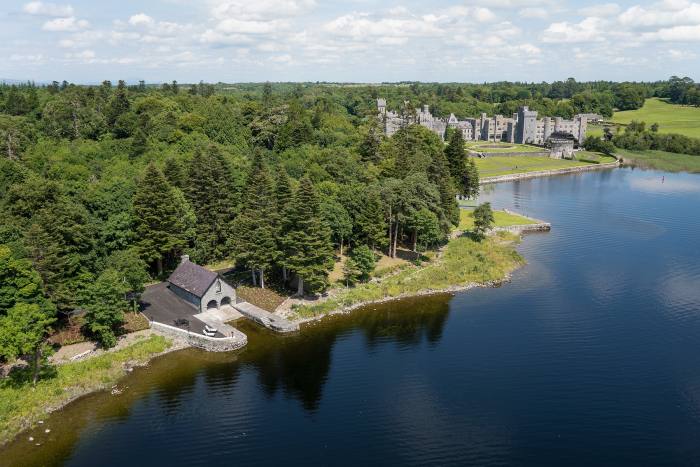 Ashford Castle in Galway, with its Hideaway Cottage in the foreground