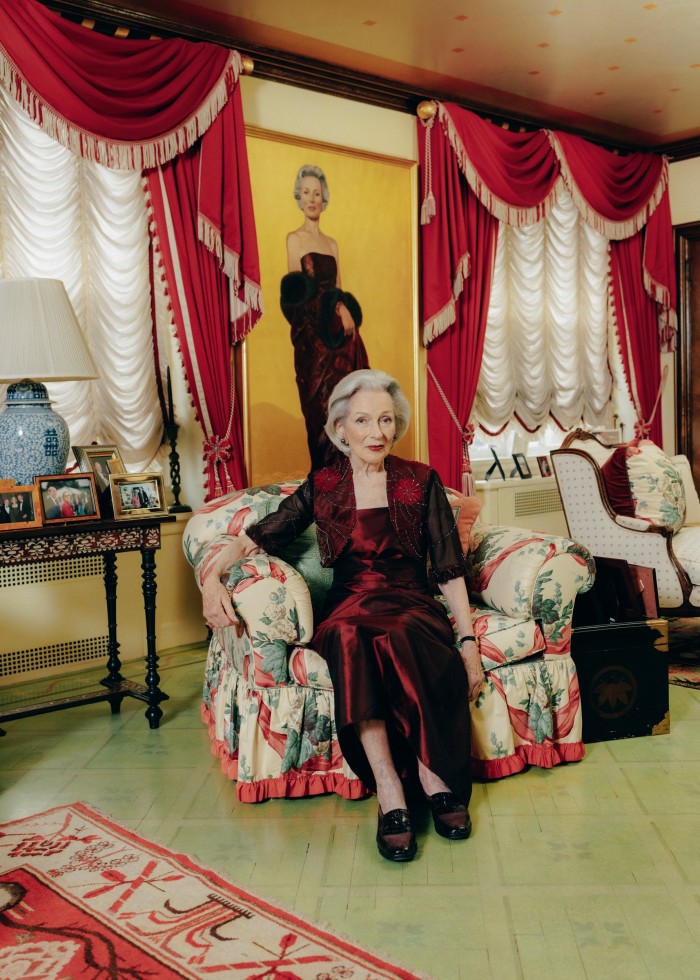 Barbara Tober at her home in New York. Behind her is her portrait painted by James Childs in 2002