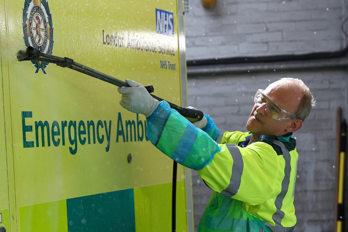 Liberal Democrat leader Sir Ed Davey cleans an ambulance in London as part of his campaign to highlight the challenges facing the NHS