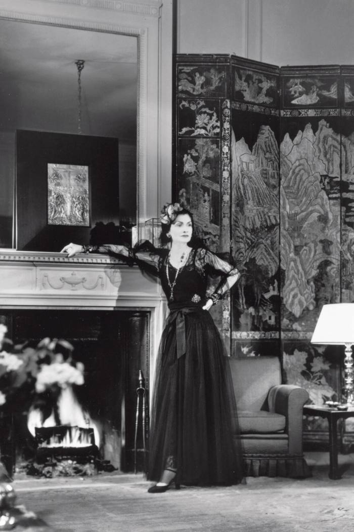 Gabrielle Chanel in her suite at the Paris Ritz in a 1937 advertisement
