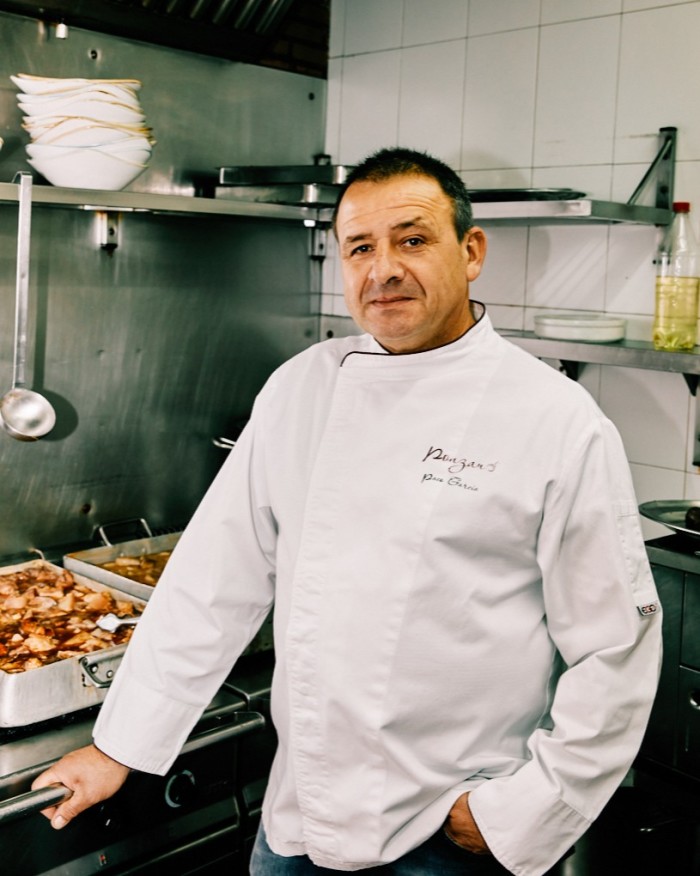 Ponzano owner Paco García standing by the ovens in his kitchen