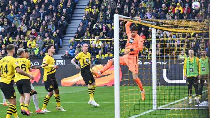 Action from football match between Borussia Dortmund and Bayer Leverkusen