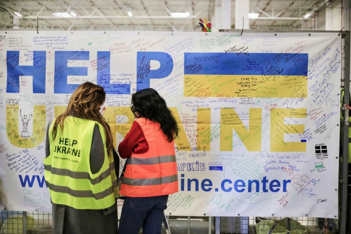two volunteers at the Help Ukraine centre in Lublin, Poland