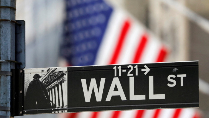 A street sign for Wall Street is seen outside the New York Stock Exchange, New York