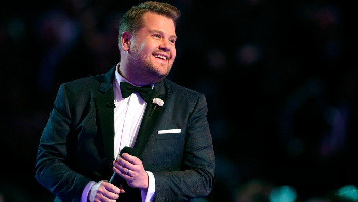 James Corden on stage at an event
