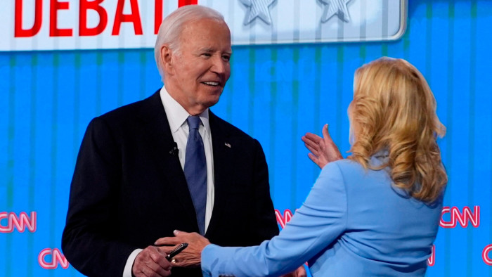 First lady Jill Biden, right, hugs President Joe Biden at the conclusion of a presidential debate with Republican presidential candidate former President Donald Trump 