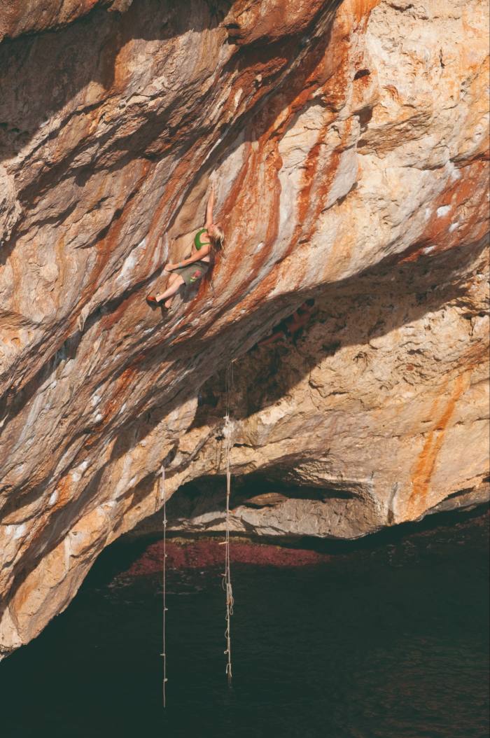 Emily Harrington deep-water soloing on Mallorca’s Cova del Diablo