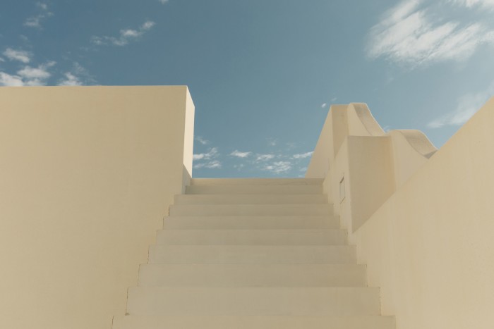 Open-sided white steps lead up to the roof terrace
