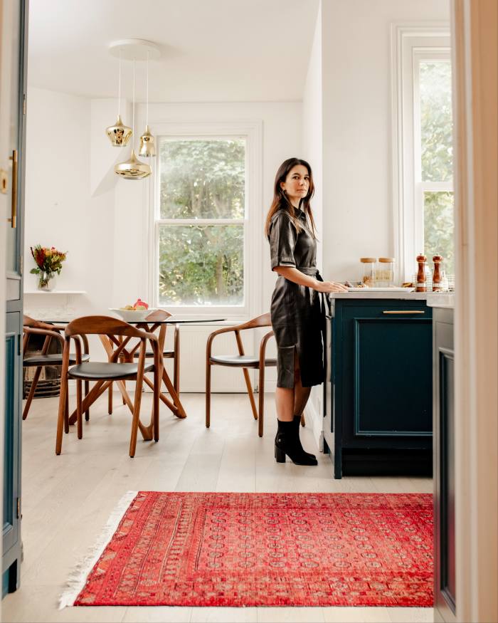 BBC World News presenter yalda Hakim in her kitchen, beside her Afghan rug