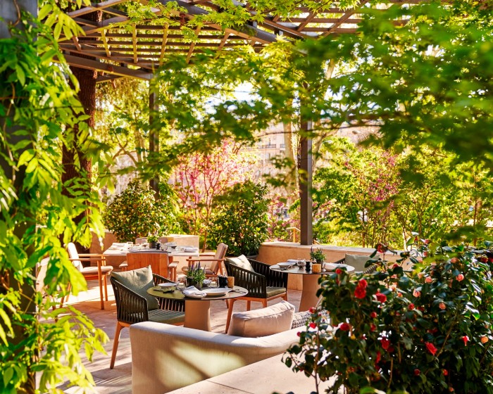 The leafy terrace of the hotel’s Las Brasas de Castellana restaurant